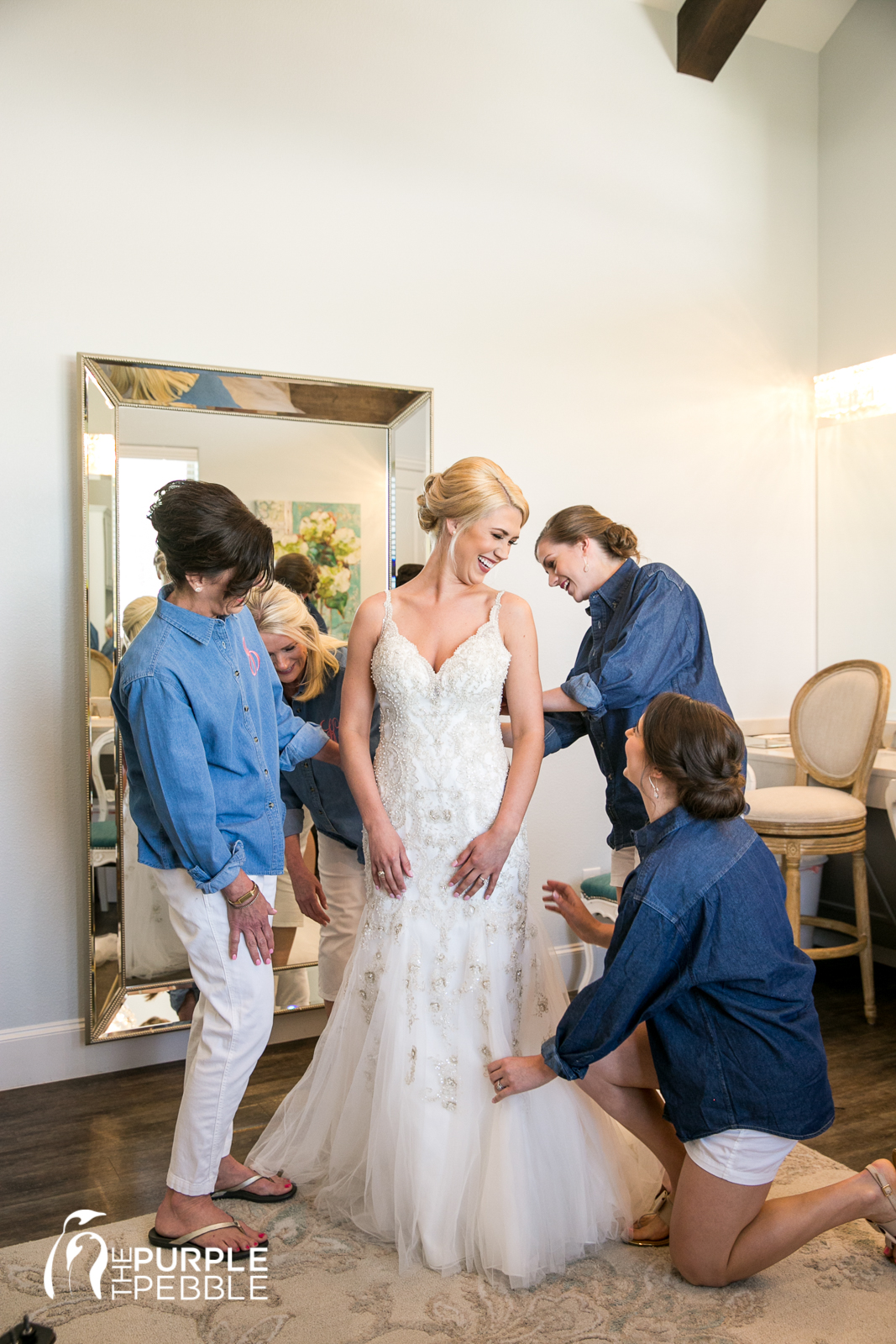 Bride Putting On Gown