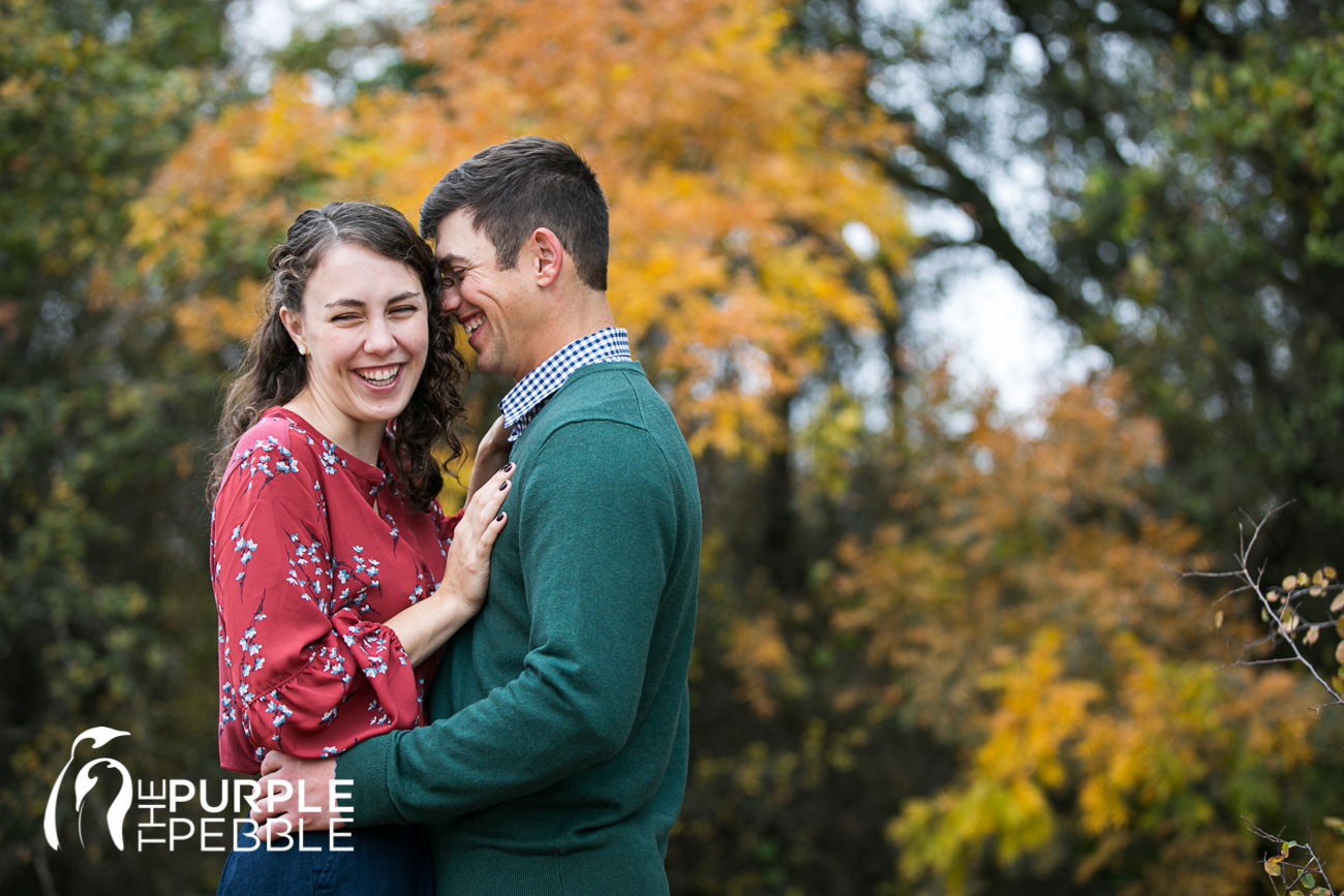 Couple cuddles up for their fall engagement session