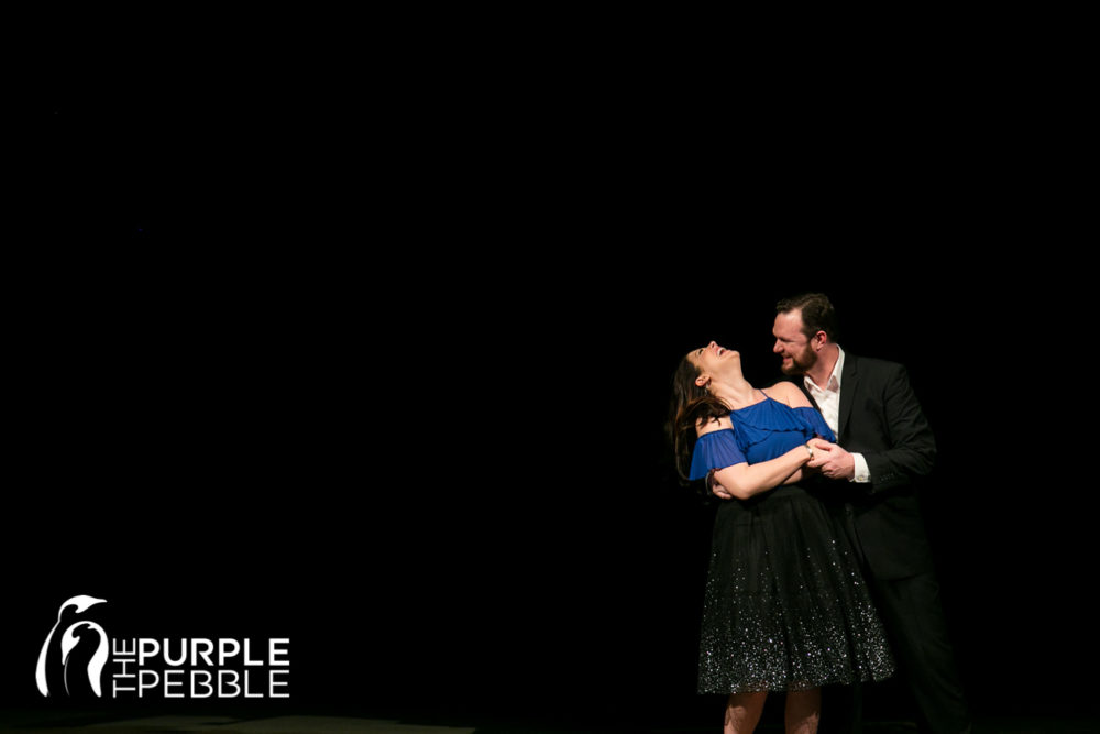 Acting couple photographs their engagement session in theatre